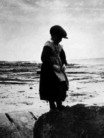 Boy in petticoat, Inis Meain, Co. Galway, 1930. It is thought that young boys were sometimes dressed in skirts to protect them from fairy abduction. A belief existed that the fairies would choose boys before girls.