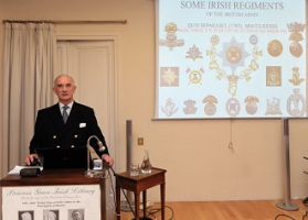 Colonel Sir William Mahon with a slide of Irish Regiments in the background